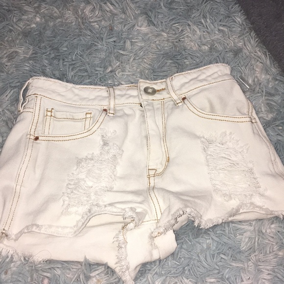 womens white ripped shorts